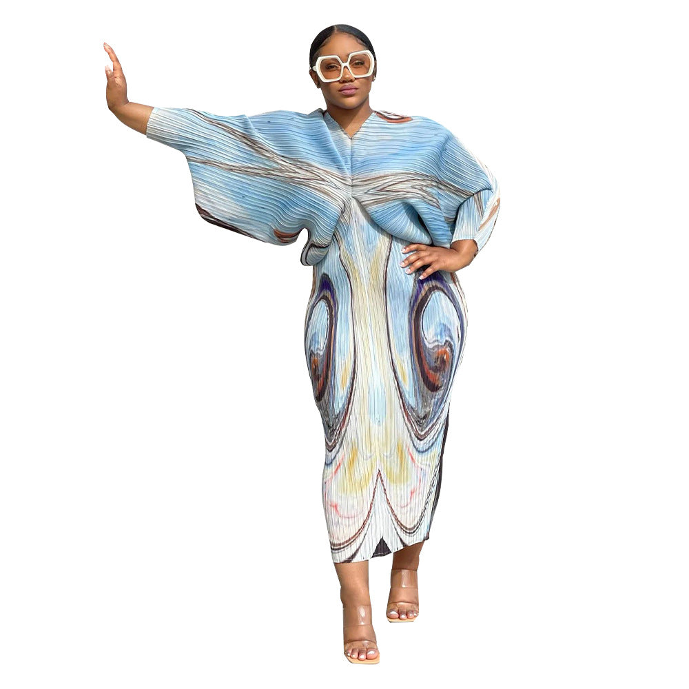 V-neck dress with pleated batwing sleeves in contrasting colors