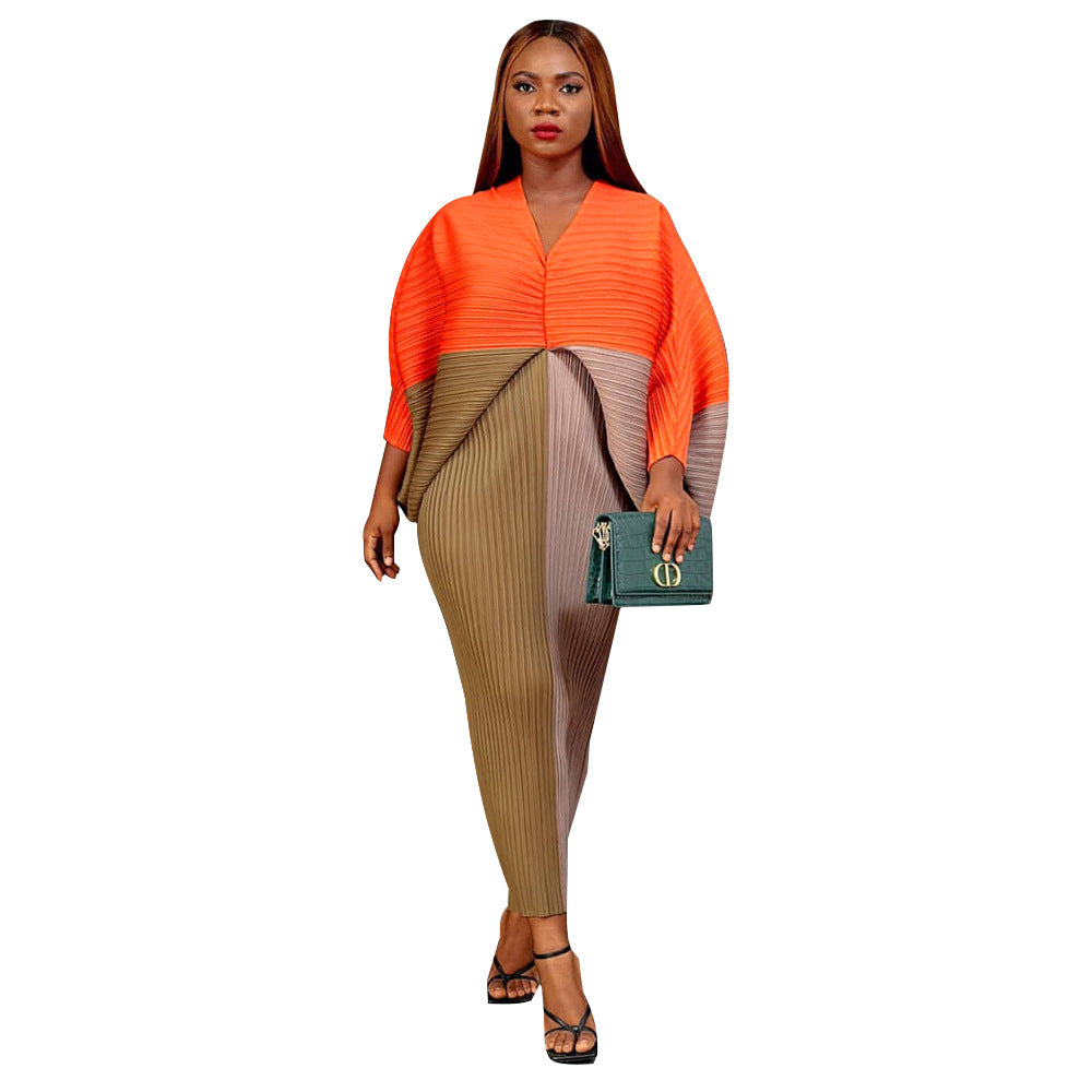 V-neck dress with pleated batwing sleeves in contrasting colors