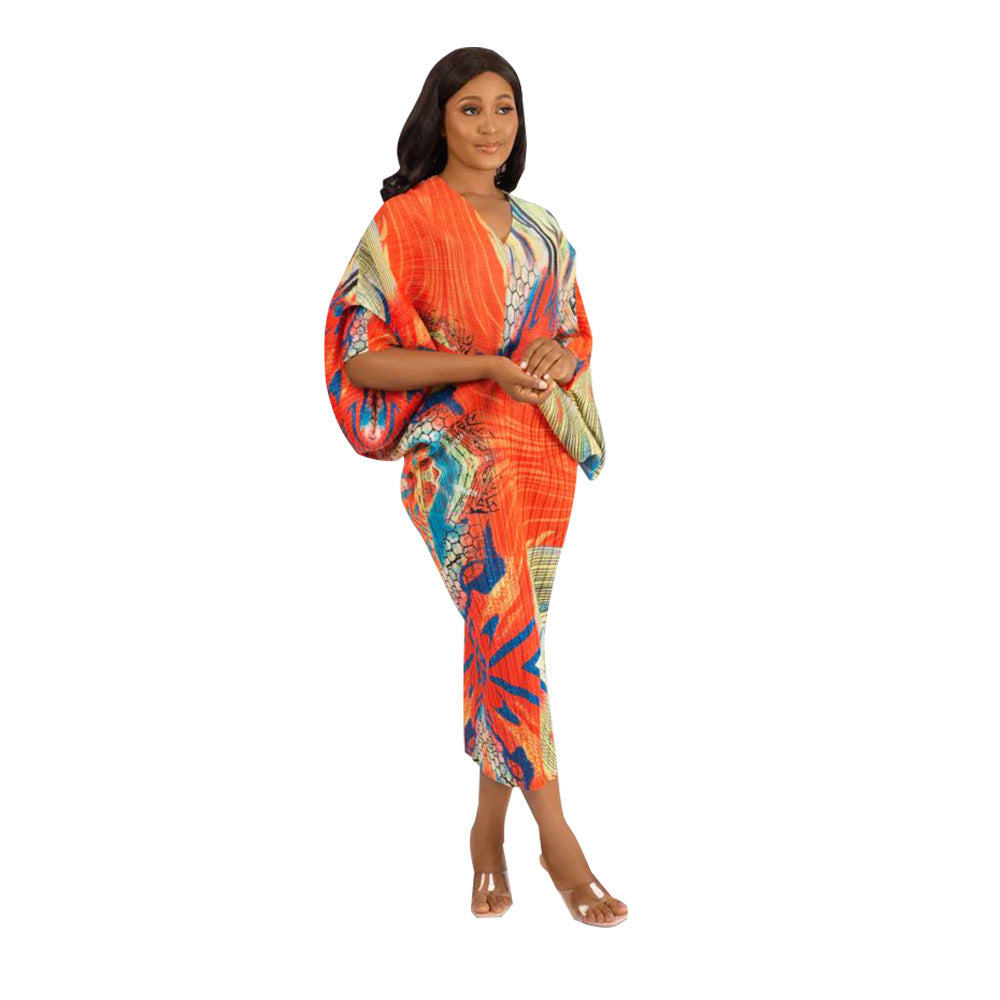 V-neck dress with pleated batwing sleeves in contrasting colors