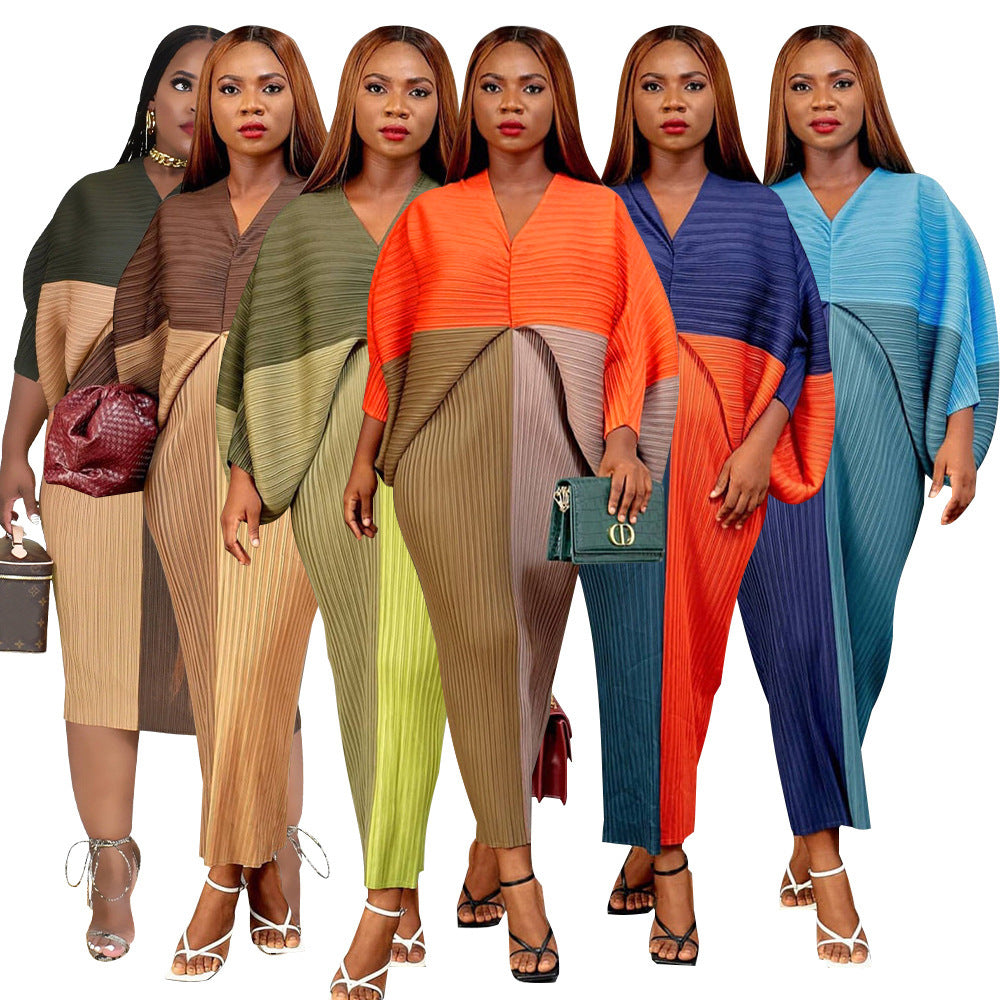 V-neck dress with pleated batwing sleeves in contrasting colors