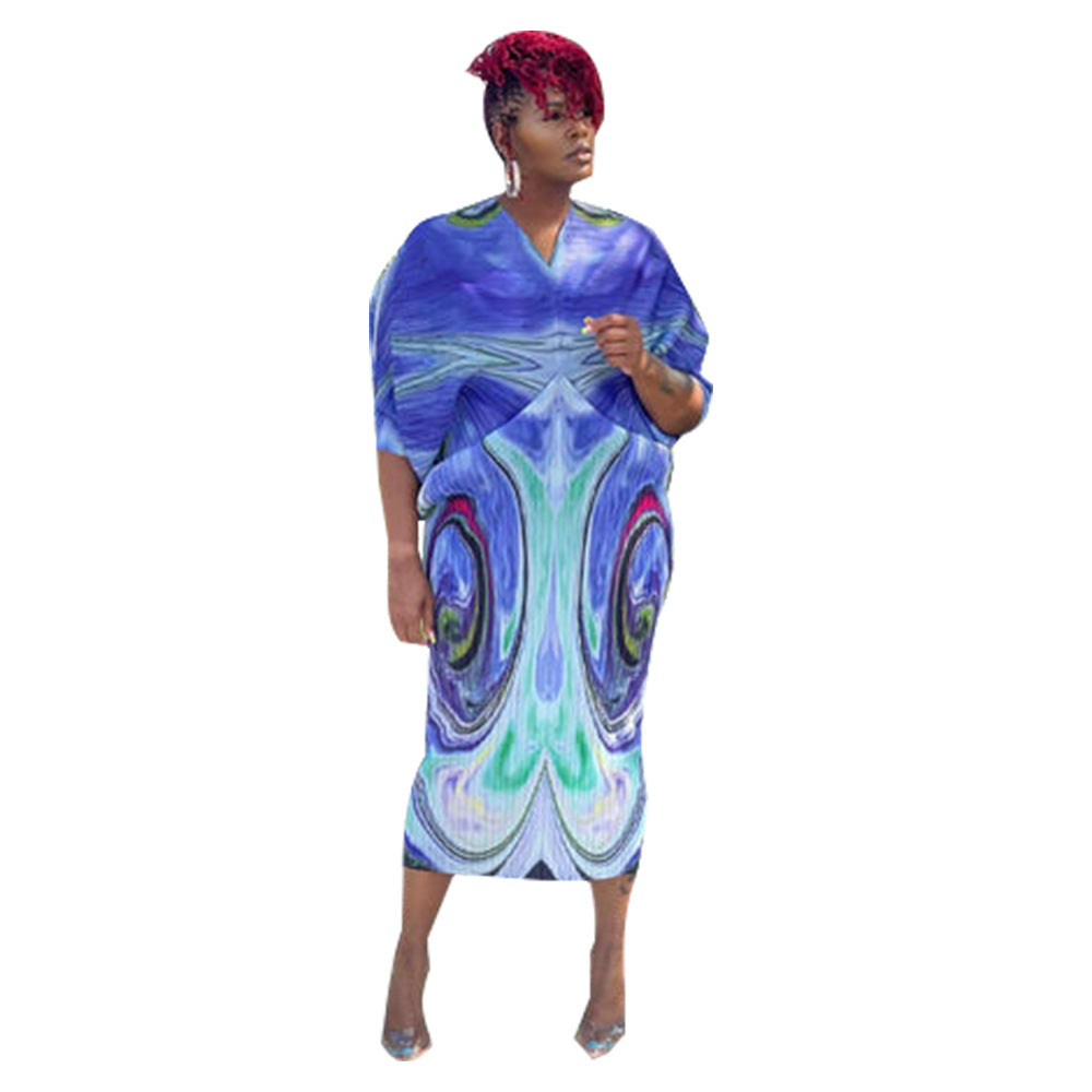 V-neck dress with pleated batwing sleeves in contrasting colors