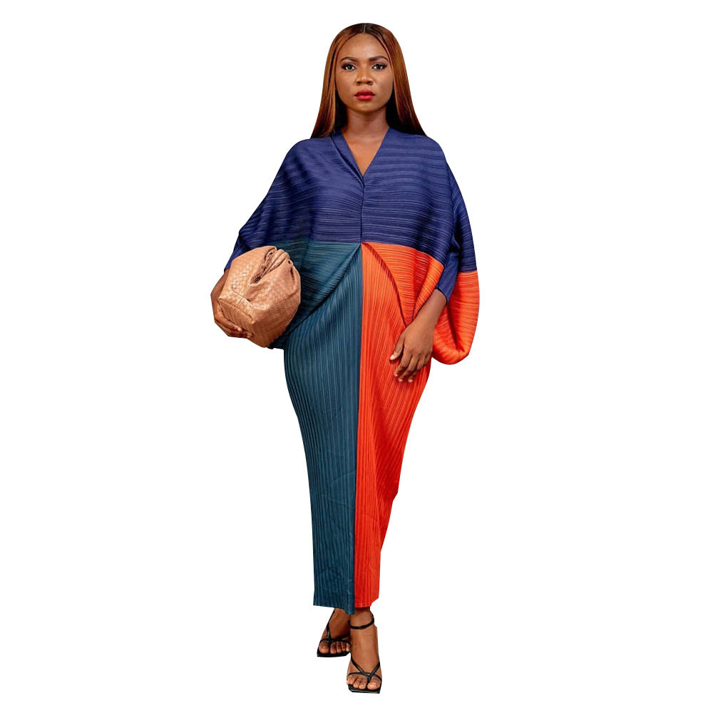 V-neck dress with pleated batwing sleeves in contrasting colors