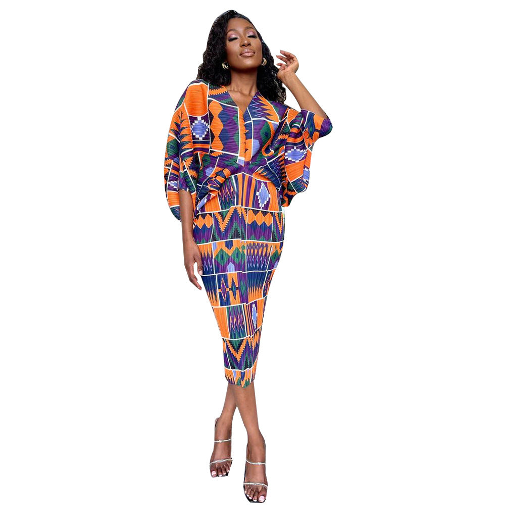 V-neck dress with pleated batwing sleeves in contrasting colors